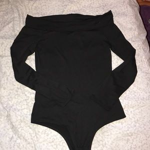 Off the shoulder, collared black bodysuit.